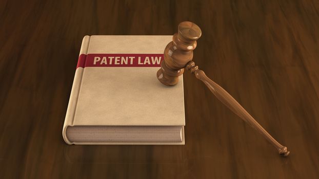 Patent law book with gavel on it. Concept illustration
