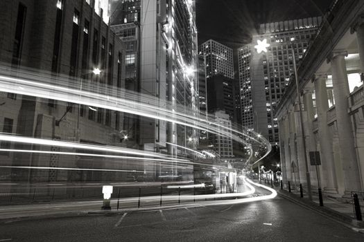 Traffic in city at night in black and white toned