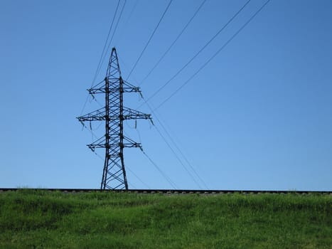 Electricity tower with power line cable and blue sky