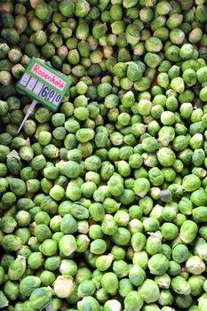 Brussels sprouts on a market stal with the price tag