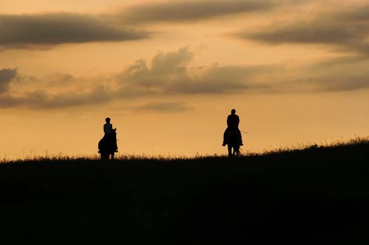 Image of the romantic horseback ride - couple on the horses