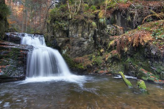 Shot of the fall of water. Stream Huntava - natural area - nature preserve.
Resov, Czech republic, Europe.