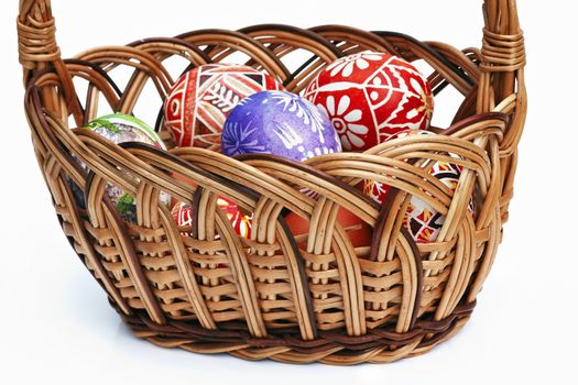 Detail of the painted Easter Eggs in wicker basket - basket full of Easter Eggs