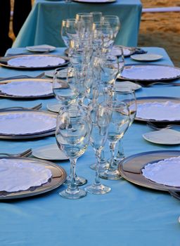 Exterior place setting for ocean side wedding celebration