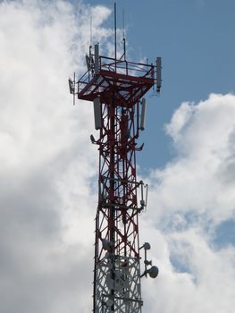 Communications antenna tower with repeater equipment