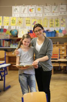 smiling student and teacher in the classroom - hochformat