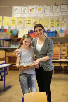 smiling student and teacher in the classroom - hochformat