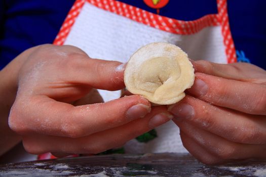 hand made ravioli getting prepared on table 