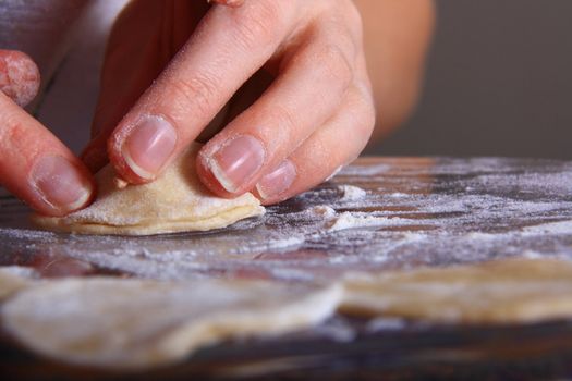 hand made ravioli getting prepared on table 