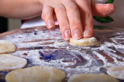 hand made ravioli getting prepared on table 