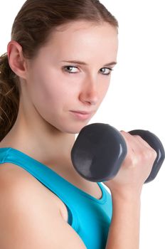 Woman working out with dumbbells at a gym, isolated in a white background