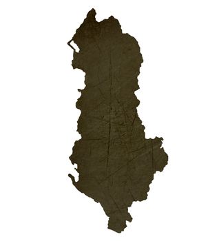Dark silhouetted and textured map of Albania isolated on white background.