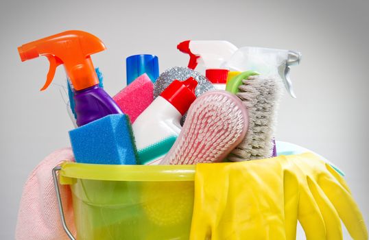 full box of cleaning supplies and gloves isolated on white