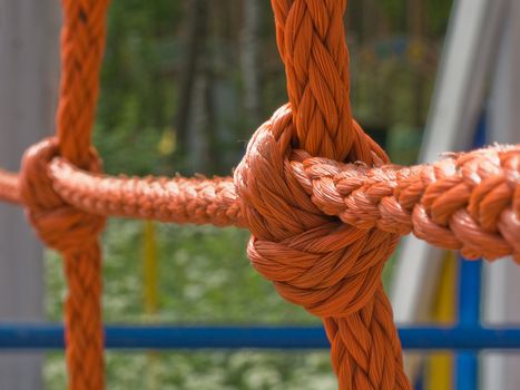 Tied up rope knot on background