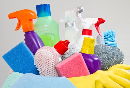 full box of cleaning supplies and gloves isolated on white