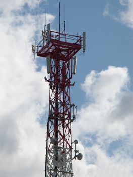 Communications antenna tower with repeater equipment