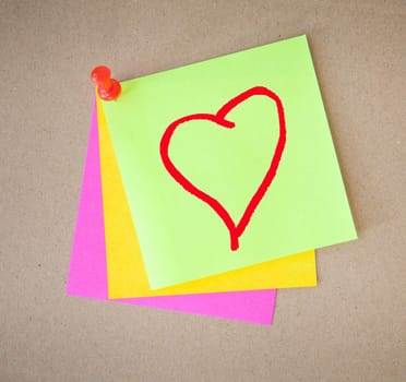 color paper and pin on wood texture background