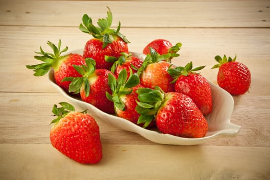 Red strawberries on old wood table