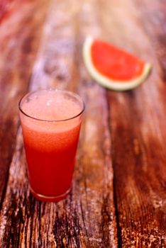 fresh organic watermelon juice over wooden boards