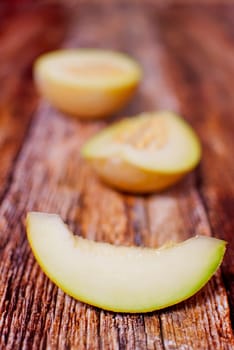 fresh organic melon slice over wooden boards