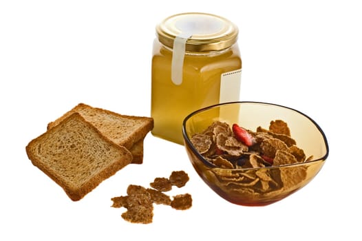 Bowl of cereals with honey jar and toasted bread isolated on white