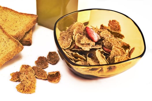 Bowl of cereals with honey jar and toasted bread isolated on white