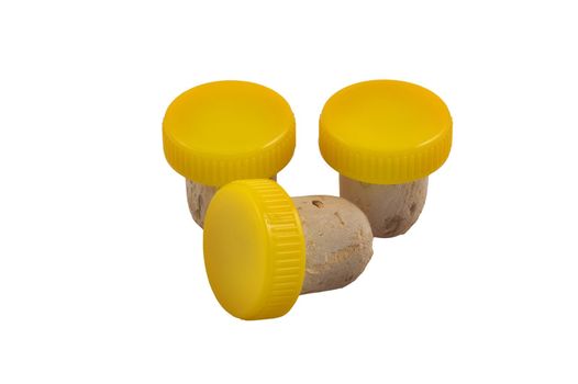 Three yellow corks isolated on white