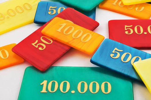 Colored gambling chips on white background