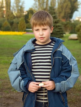 little boy in green park