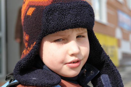 The little boy in a winter cap
