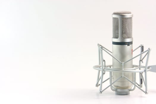 isolated recording microphone with blank space on the left side for message music concepts horizontal