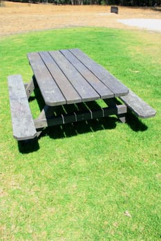 Picnic table in a park on a sunny day.
