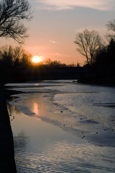 Early spring. Sunset. Ice on the river.