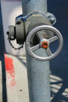 Close up of a water valve on a sunny day.
