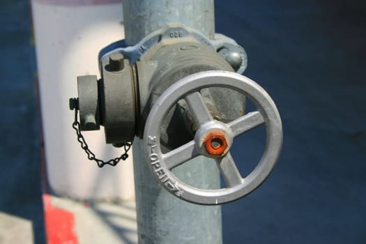 Close up of a water valve on a sunny day.
