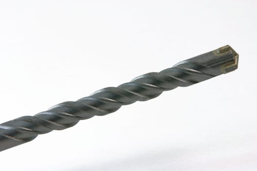 closeup detail from metalic drill on white background construction concepts