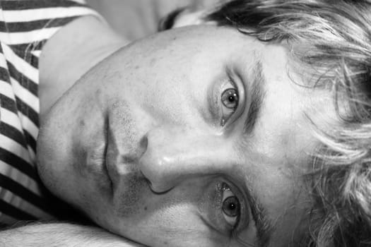 Sad young man close up. Black � and - white portrait.