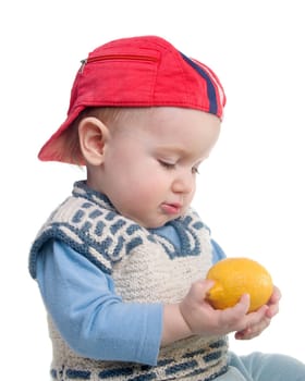 Vigorous child and fresh lemon.Rustic boy and present fresh citrus