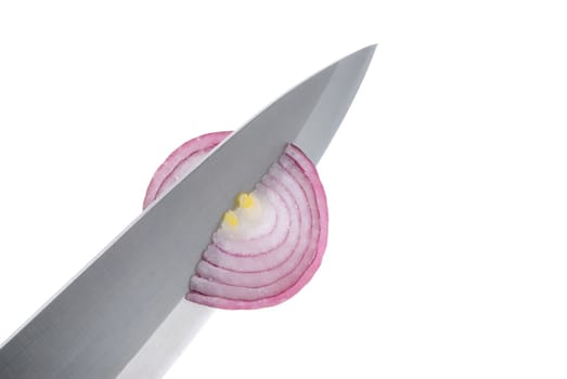 Food preparation-cuts an onions on small slices on a white background