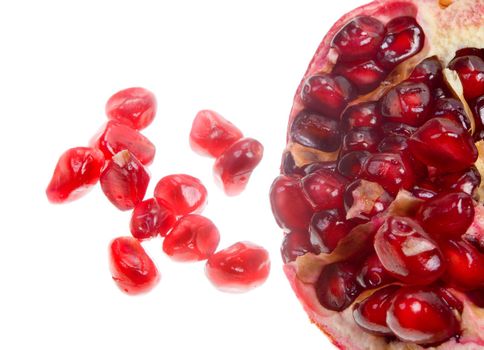 macro close-up of cut red fresh pomegranate in white background

