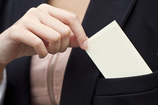 Asian woman holding a blank business card