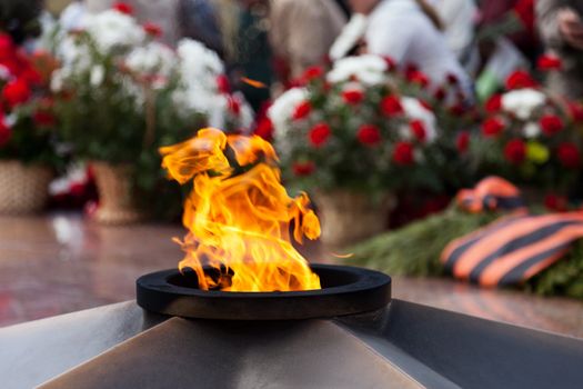 Eternal Flame memorial pink flower at Victory day