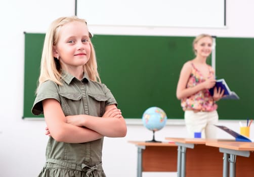 portrait of schoolgirl crossed her arms and looked at the camera