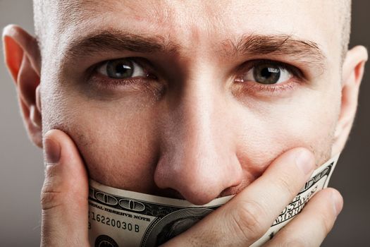 Human silence - dollar currency gag shut voiceless man mouth