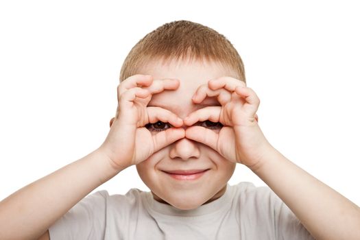 Smiling child boy hand hiding eyes for fun peeking