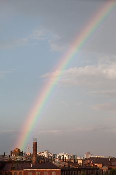 Multi color spectrum nature rainbow on rain cloud sky