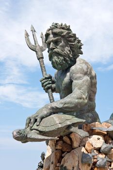 A large public statue of King Neptune  that welcomes all to VA beach in Virginia USA.