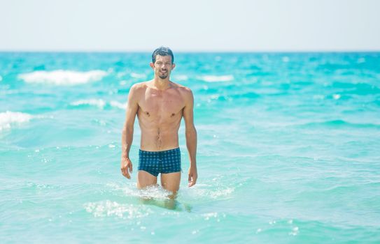 Happy Swimming. Cute adult men in the water.