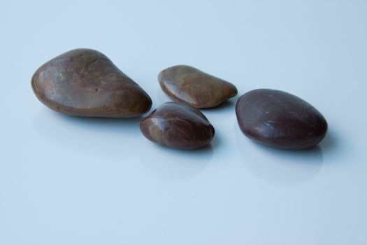 Four rocks that could be used for massage rocks, zen rocks, or many other things.