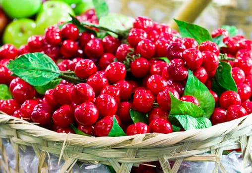 Fake red Cheries on basket in the market